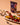 Plated food with a 'peré peré tandoori' package on a beige background