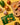 Turmeric powder packet with vegetables on a yellow background