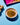 Turmeric powder in a bowl on a blue background with turmeric roots and a colorful package.
