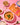 Butter chicken dish with ingredients and Amul brand packaging on a pink background