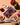 Peri peri tandoori spice mix package on a cutting board with vegetables and spices.